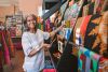 Boutique owner arranging items in the store